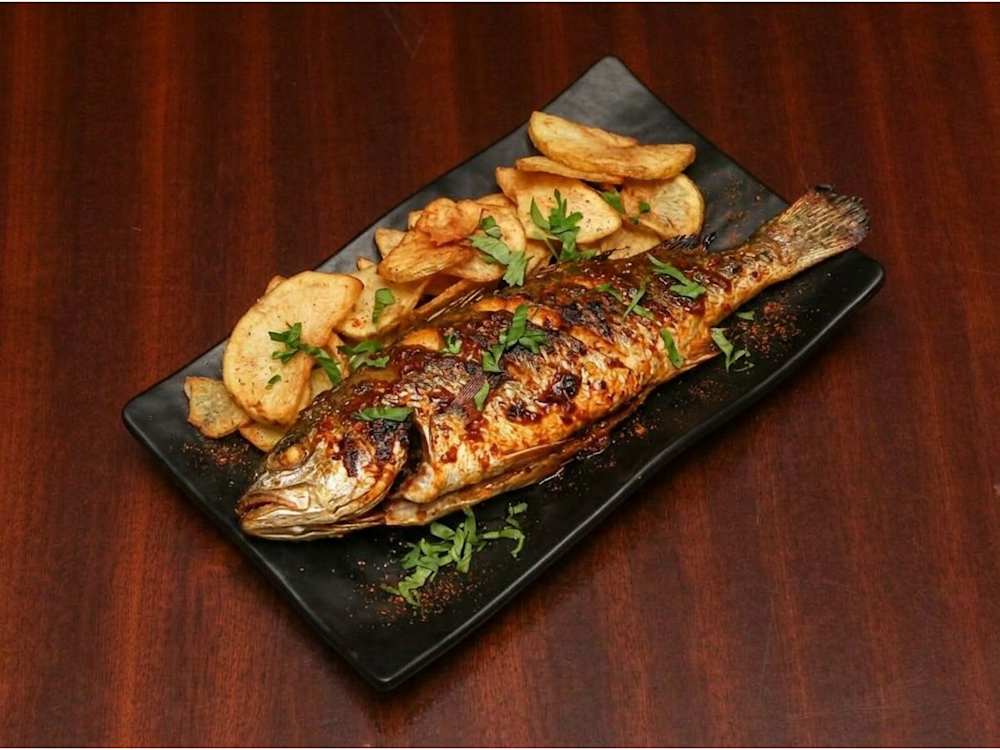 Grilled fish with sautéed potatoes