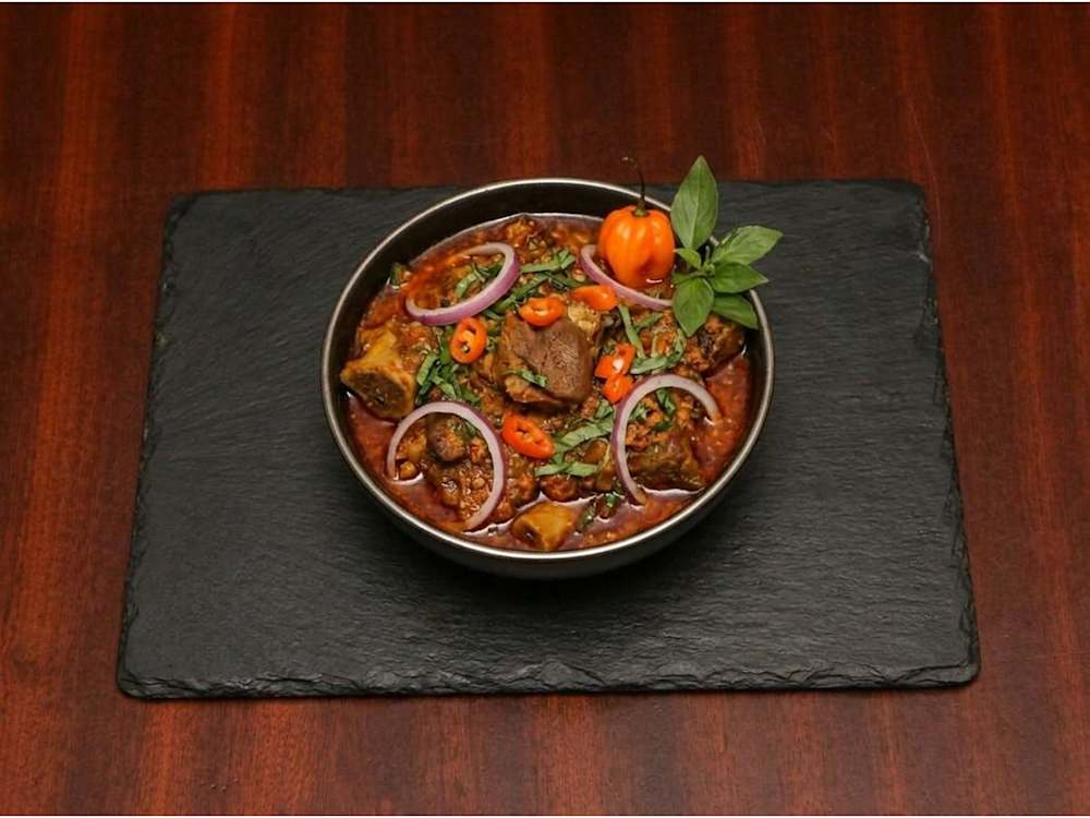 Goat meat pepper soup with scotch bonnet