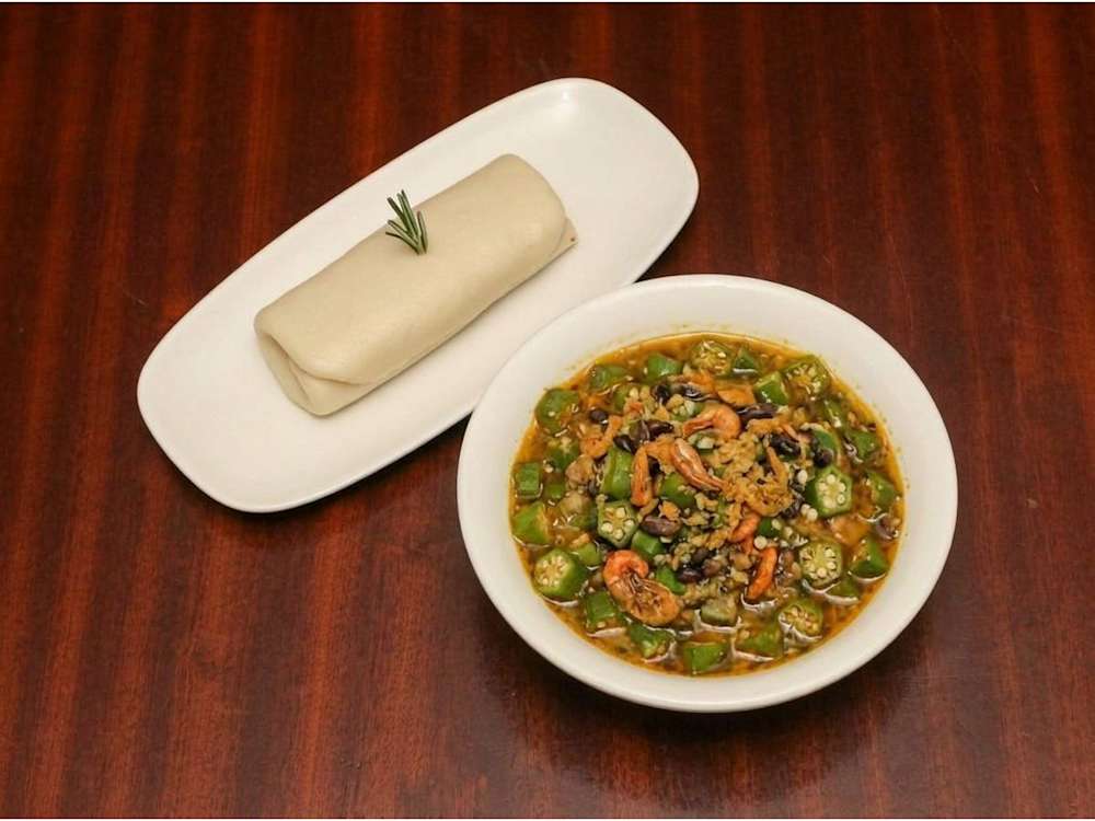 Okra soup with seafood and swallow
